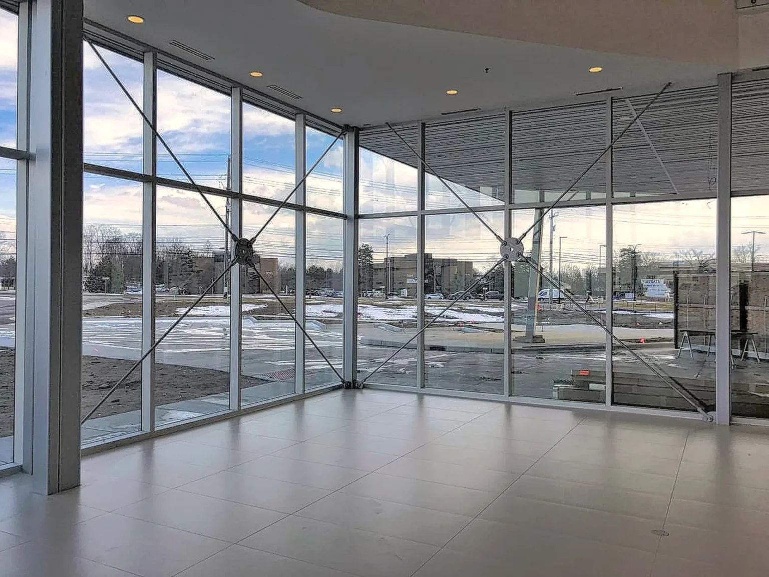 Glasco Installing glass curtain walls for Ferrari Dealership